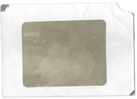 This old photo was scratched and damaged by mold.